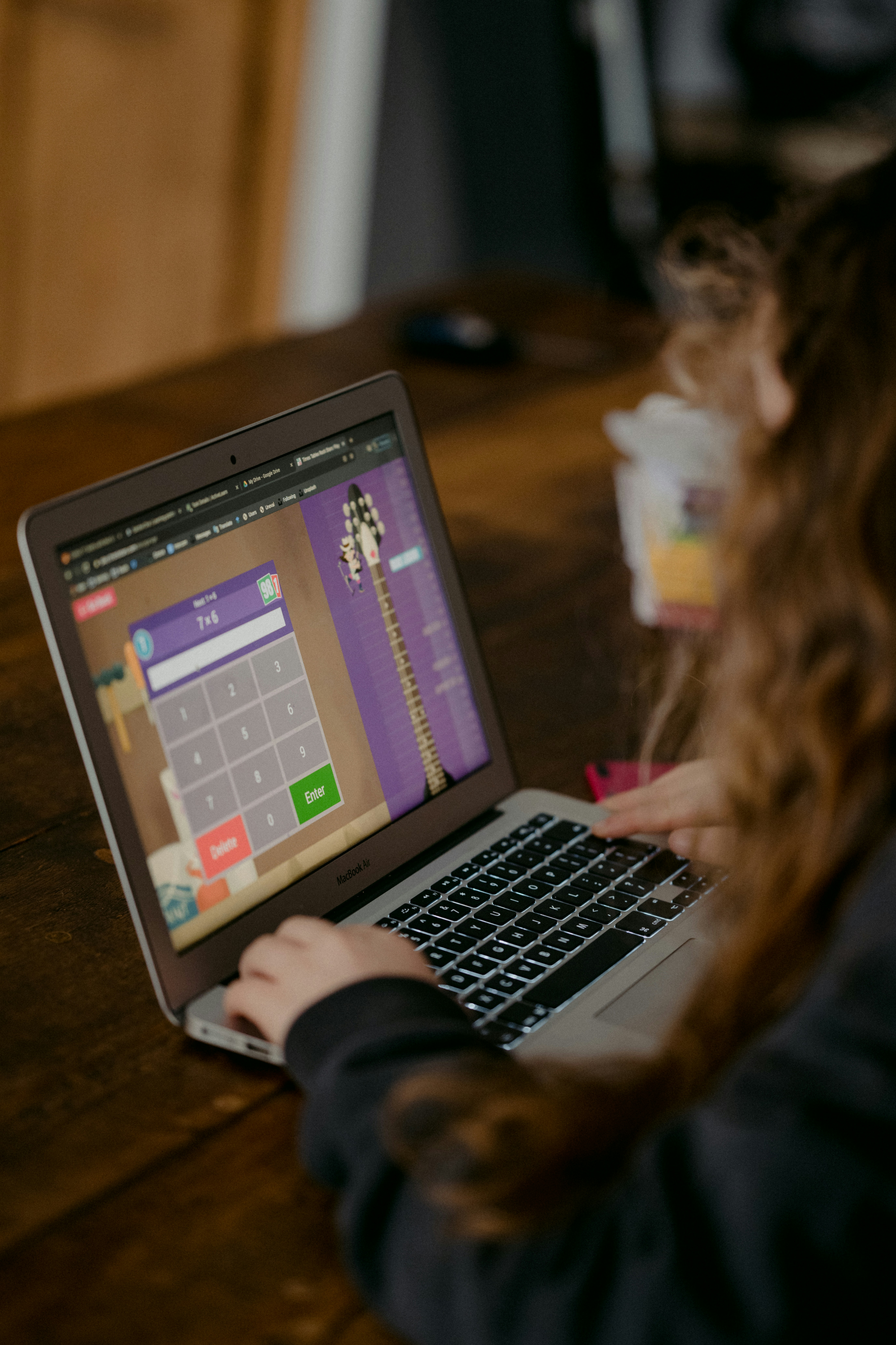 Student working through an adaptive learning programme on a laptop